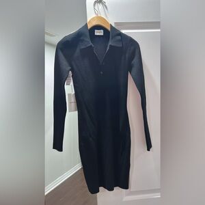 Black- collar V neck (with buttons). Brand new (with tags.)
